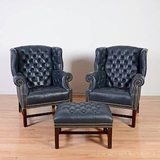 Pair Hancock & Moore leather wing chairs and stool