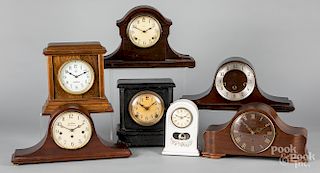 Seven assorted mantel clocks.