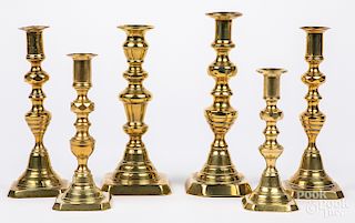 Six English brass candlesticks