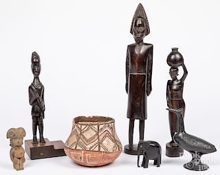 Ethnographic pottery and wood carvings.