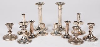 Group of weighted sterling silver candlesticks.