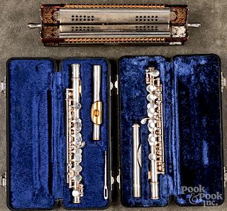 Two cased piccolo flutes, etc.