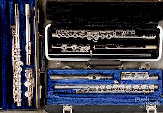 Three cased flutes