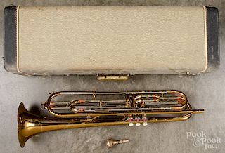 Cased Getzen deluxe trumpet.