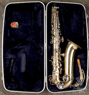 Cased Conn saxophone.