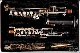 Two cased Selmer clarinets.