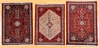 Three similar Persian style carpets