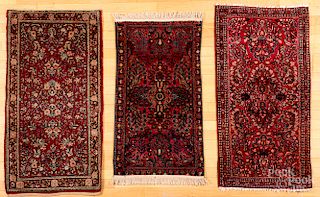 Three Sarouk mats.