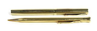 Two 14 Karat Yellow Gold Writing Instruments, Sheaffers, Length of longest 5 inches.
