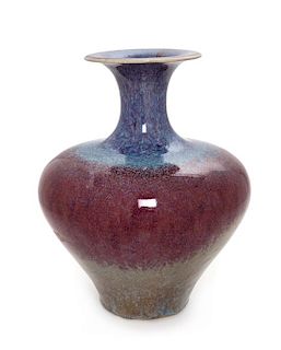 * A Flambe Glazed Stoneware Vase Height 10 1/2 inches.