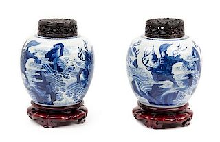 * A Pair of Blue and White 'Mythical Beast' Porcelain Ginger Jars Height 8 1/2 inches.