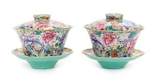 * A Pair of Famille Rose Porcelain 'Millefleur' Tea Cups and Saucers Diameter of tea cup 4 1/8 inches.