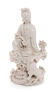 * A Blanc-de-Chine Porcelain Figure of Guanyin Height 9 1/8 inches.