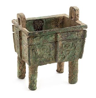 A Rare Bronze Ritual Food Vessel, Fangding Height 8 x width 6 3/4 x depth 5 1/4 inches.