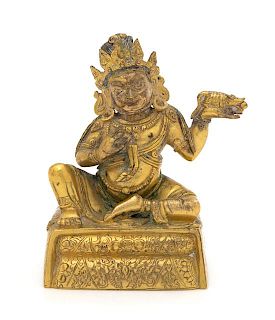 * A Sino-Tibetan Gilt Bronze Figure of Jambhala Height 4 inches.
