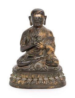 A Sino-Tibetan Parcel Gilt Bronze Figure of Guru Height 8 inches.