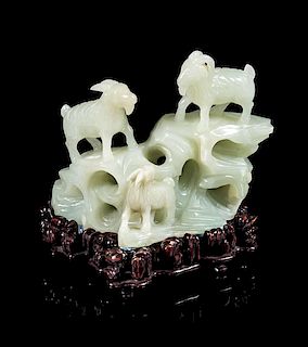 * A White Jade Carving of Three Rams Height 4 1/8 inches.
