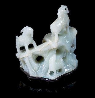 * A White Jade Carving of Three Rams Height 4 inches.