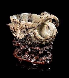 * A Chicken Bone and Russet Jade Libation Cup Height 3 1/4 inches.