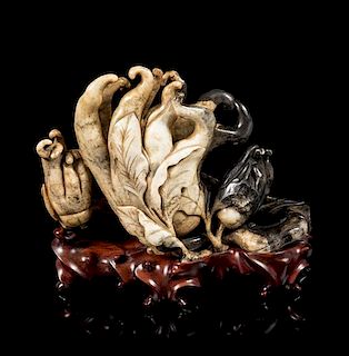 * A Chicken Bone and Black Jade Carving of a Buddha's Hand Cirtrons Length 9 inches.