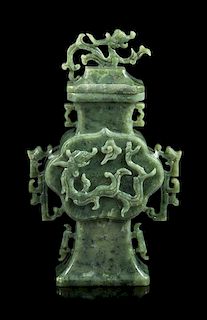 * A Spinach Jade 'Chilong' Covered Vase Height 12 inches.