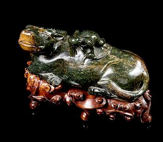 * A Spinach Jade Figural Group of a Ox and a Frog Length 9 1/2 inches.