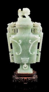 * An Apple Green and Pale Celadon Jadeite Covered Vase Height 9 1/2 icnhes.