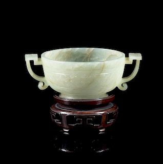 A Celadon and Russet Jade Handled Cup Length 4 3/8 inches.