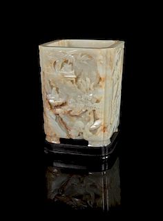 A Pale Celadon and Russet Jade Brushpot, Bitong Height 6 3/8 inches.