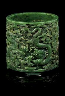 A Spinach Jade 'Dragon' Brushpot, Bitong Height 6 3/8 inches.