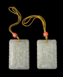 A Pair of White Jade 'Dragon and Phoenix' Plaques Length of each 2 1/4 inches.