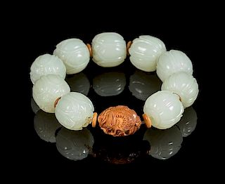 A White Jade Lotus-Shaped Bead Bracelet Diameter of bead 3/4 inches.