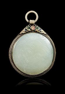 A White Jade Inset Silver Pendant Diameter of jade 1 3/4 inches.