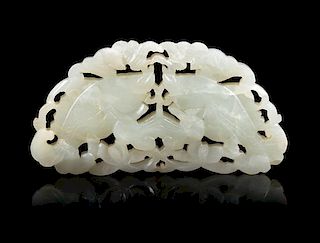 An Openwork Pale Celadon Jade 'Fish' Pendant Length 3 3/4 inches.
