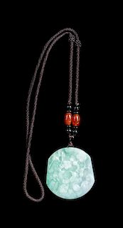 A Celadon and White Jadeite Pendant Length 2 inches.