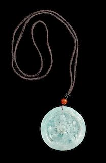 A Jadeite Pendant of Guanyin Diameter 2 1/8 inches.