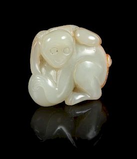 A Celadon and Russet Jade Figure of a Monkey Height 1 1/2 inches.