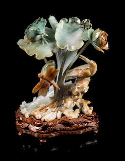 * A Green, Russet and Pale Celadon Jadeite Figural Group of Bird, Dragonfly and Lotus Height 6 3/4 inches.