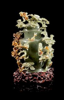 * A Spinach and Russet Jade Covered Vase Height 6 1/2 inches.