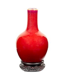 * A Copper Red Glazed Porcelain Bottle Vase Height 14 3/4 inches.