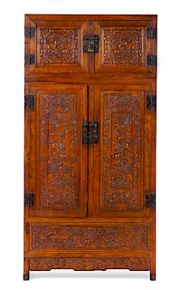 A Carved Hardwood Cabinet Height 79 x width 39 1/4 x depth 19 1/2 inches.