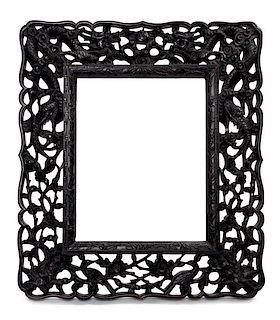 A Carved Zitan Picture Frame Height 16 1/2 x width 14 1/2 inches.