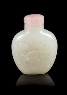 A Carved White Jade Snuff Bottle Height 2 1/2 inches.