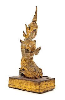 A Thai Gilt Bronze Figure of a Kneeling Deity Height 13 inches.