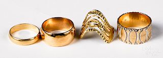 Four 14K yellow gold rings