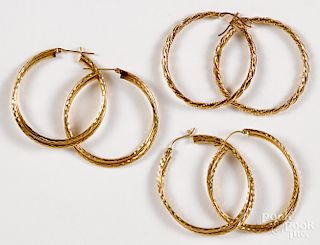 Three pairs of 14K yellow gold hoop earrings