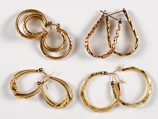 Four pairs of 14K yellow gold hoop earrings