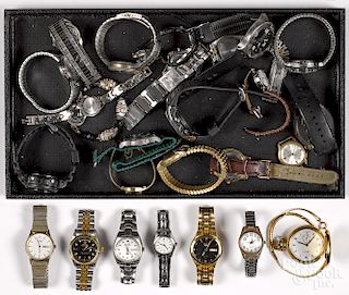 Assorted group of men's and women's wristwatches.