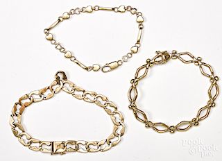 Three 14K yellow gold bracelets