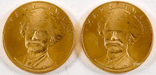 Two Mark Twain American Arts gold medallions.